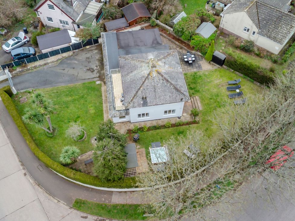 An aerial view of a house with garden and patio at Broadsands in Paignton