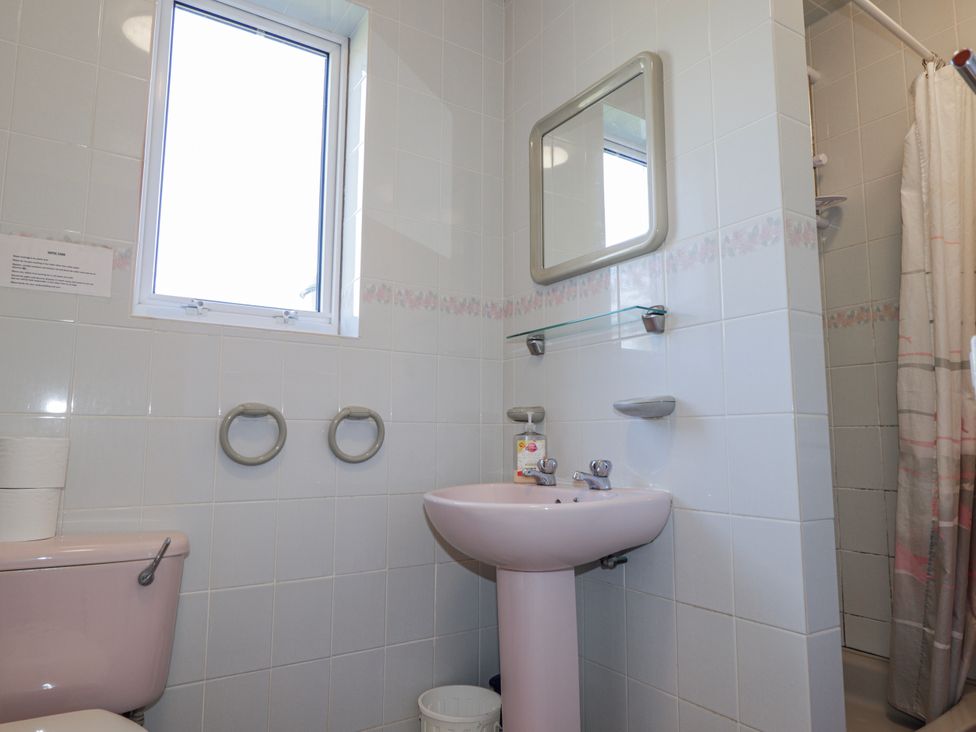 A bathroom with a sink and toilet at An Grianan in Kinlochbervie