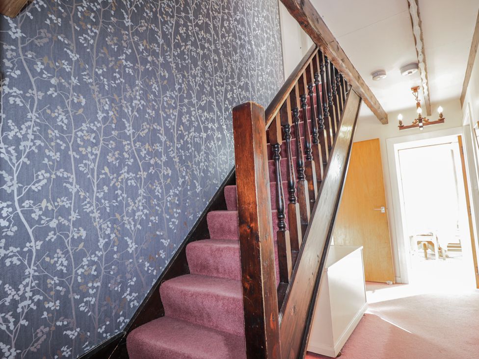 A staircase in a hallway at An Grianan in Kinlochbervie