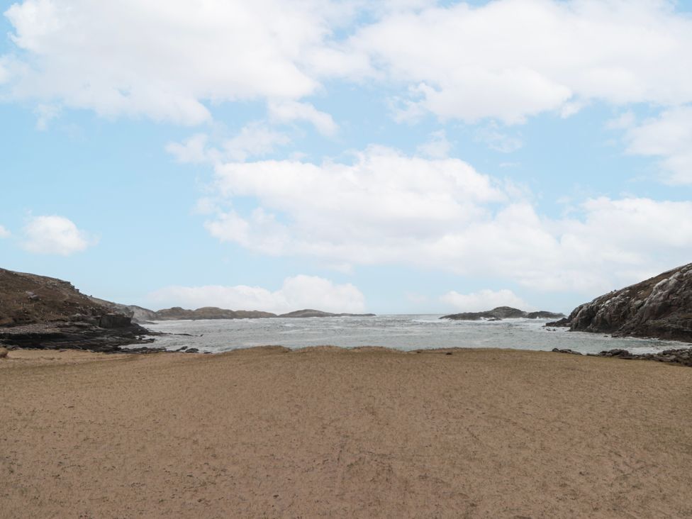 A view of the sea and sandy area at An Grianan in Kinlochbervie