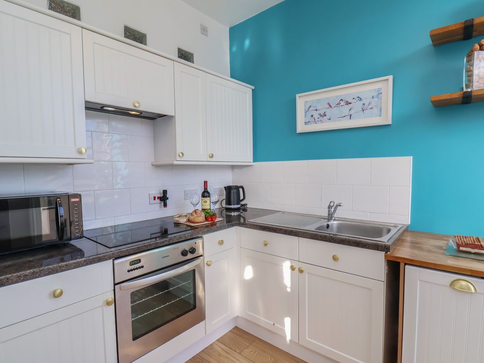 A kitchen with appliances and utensils at Masons Place in Whitby