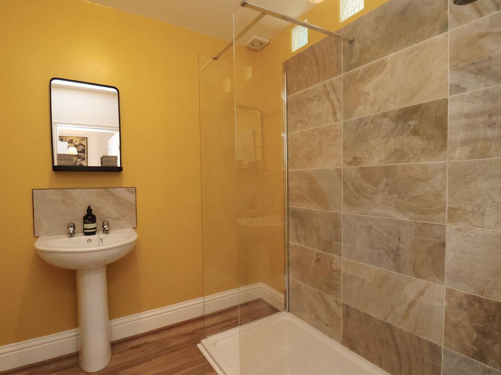 A bathroom with a sink and shower at Masons Place in Whitby
