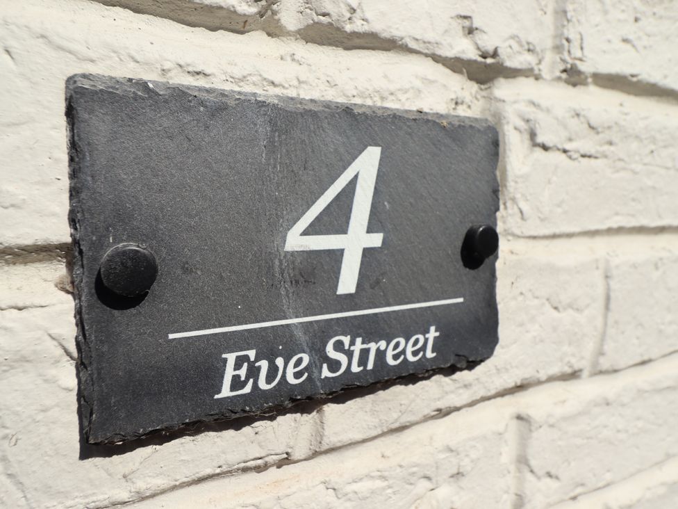 House number 4 sign on a white brick wall at 4 Eve Street Louth
