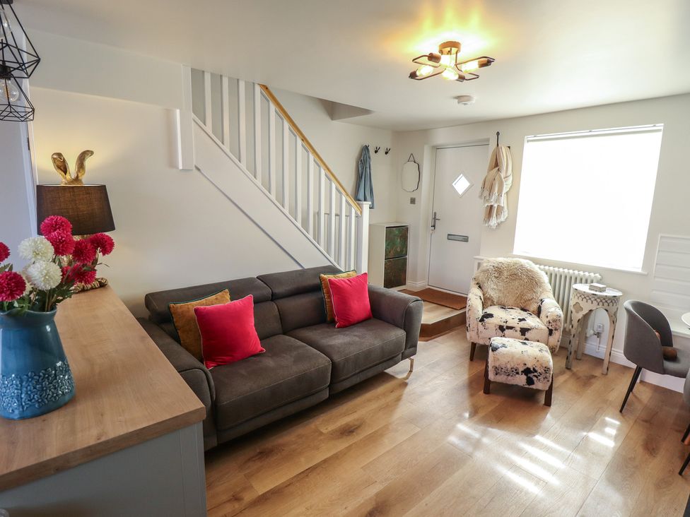 A living room with a sofa and table at 4 Eve Street in Louth