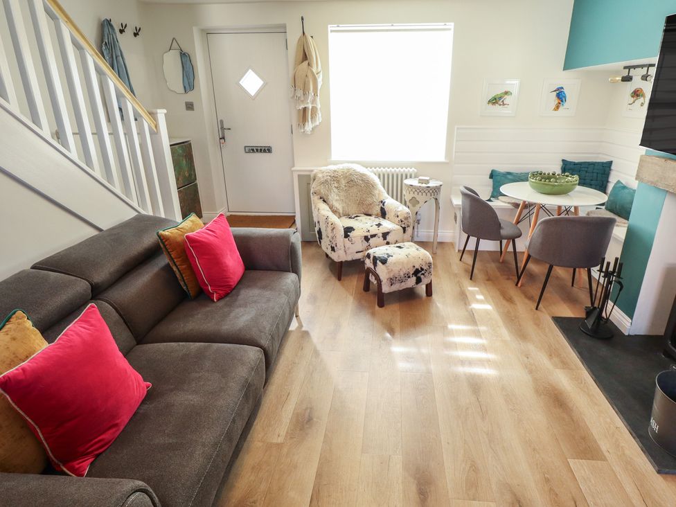 A living room with seating area and dining table at 4 Eve Street in Louth
