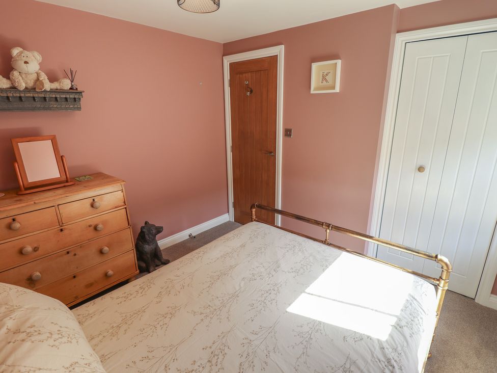 A bedroom with a bed and dresser at 4 Eve Street Louth