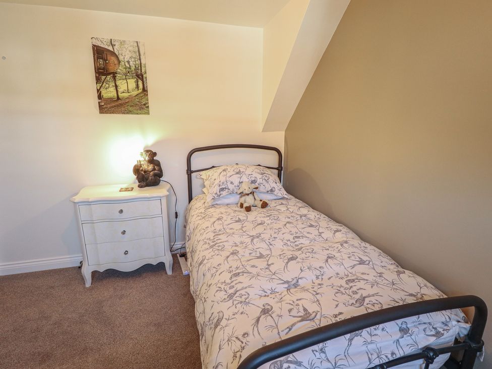 A bedroom with a bed and nightstand at 4 Eve Street in Louth