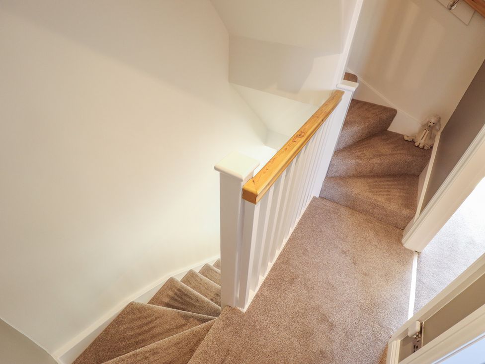 A staircase with a handrail at 4 Eve Street in Louth