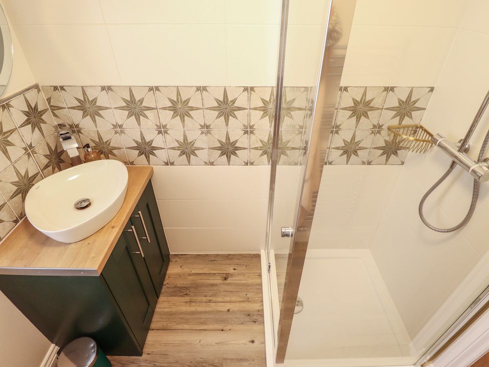 A bathroom with a sink and shower at 4 Eve Street in Louth