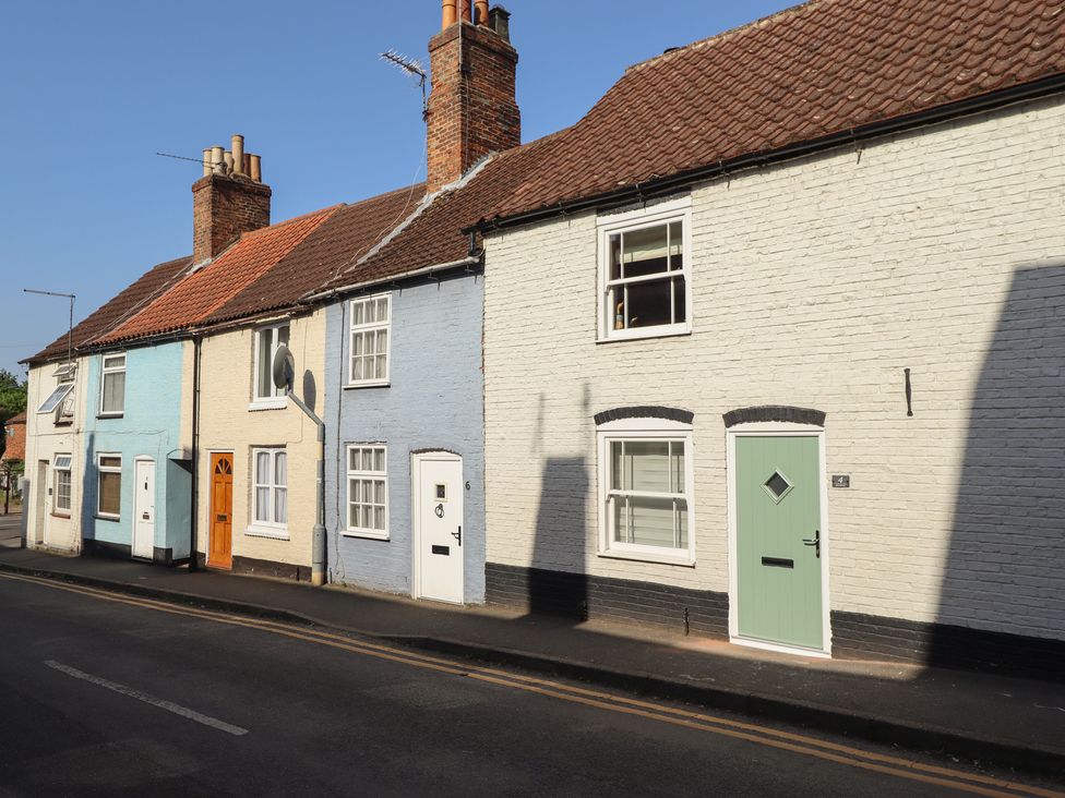 Row of colorful houses with different doors at 4 Eve Street in Louth