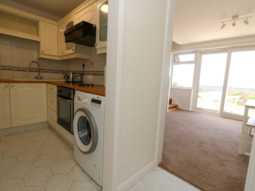 A kitchen with appliances and a view at 32 Bowleaze Coveway Weymouth