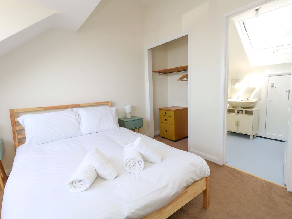 A bedroom with a bed and closet at 32 Bowleaze Coveway Weymouth