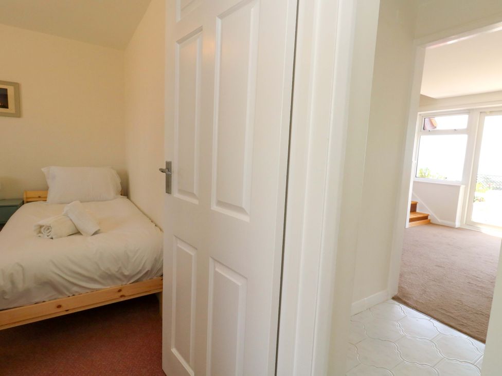 A bedroom with a bed and towel at 32 Bowleaze Coveway Weymouth