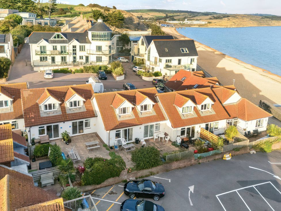 A view of buildings and beach at 32 Bowleaze Coveway in Preston