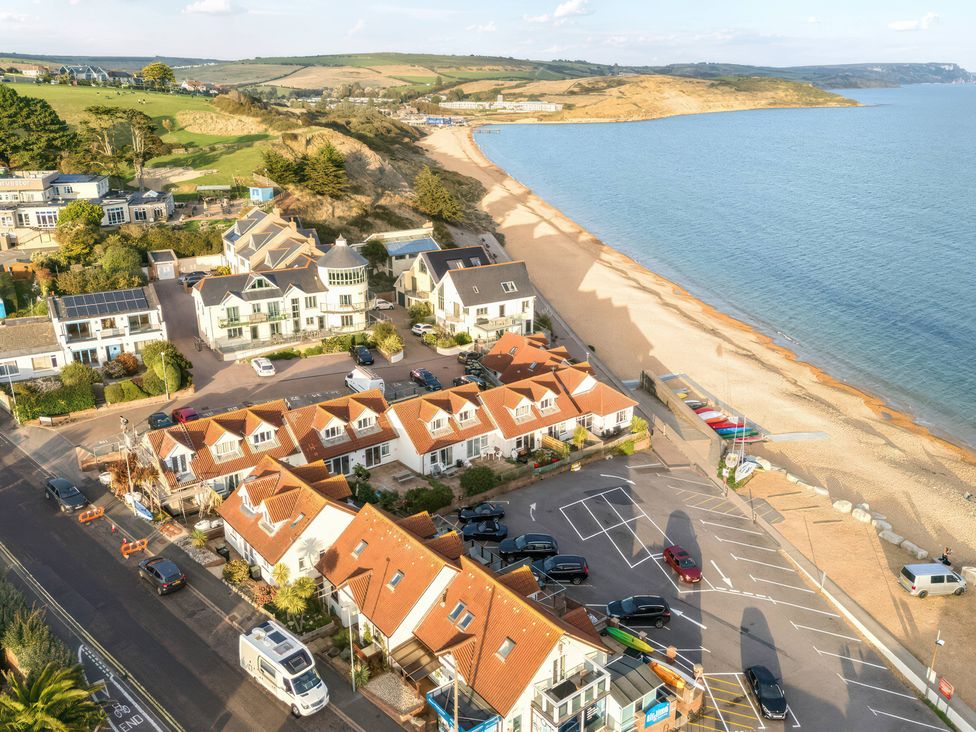 A view of houses and beach near the ocean at 32 Bowleaze Coveway in Preston