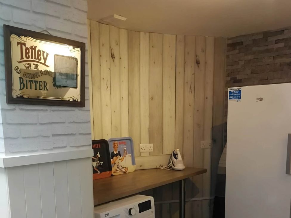 A kitchen with a fridge and microwave at House - Sleeps 7 - Garden - Pets Ok - Parking in Torquay