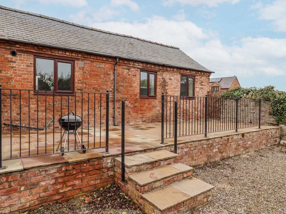 An outdoor area with a patio and grill at Elwy Cottage in St. Asaph