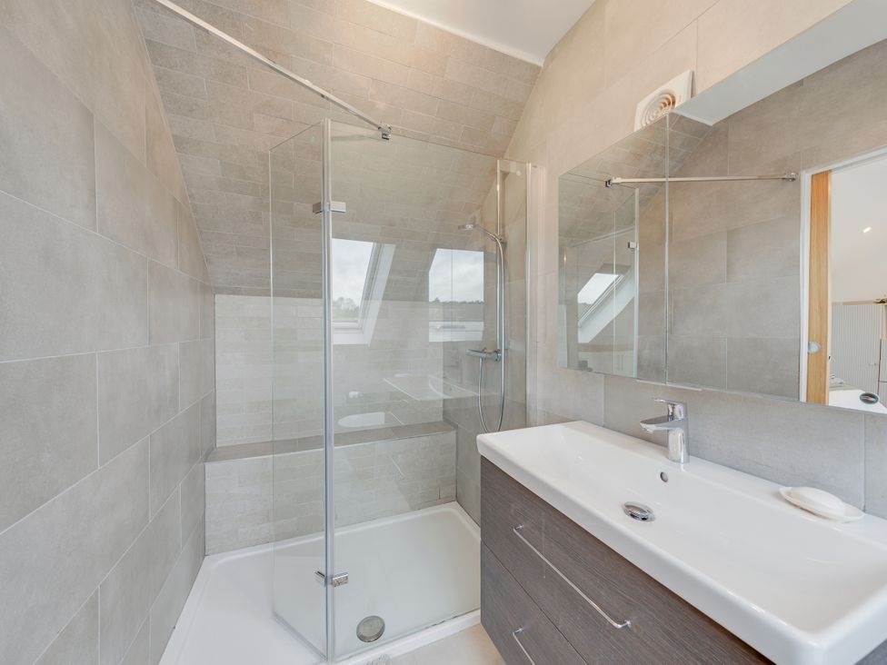 A bathroom with a shower and sink at Greenacres Farm in Harriseahead near Mow Cop