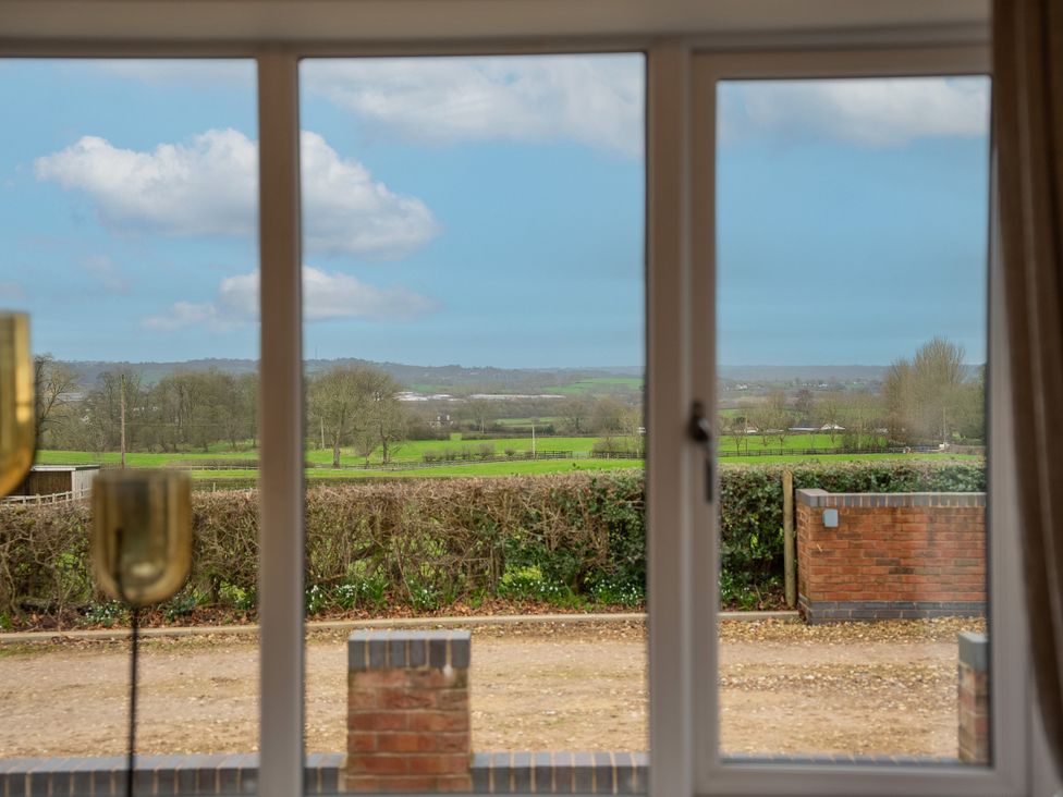 A view of the countryside from a window in the living room at Greenacres Farm Harriseahead near Mow Cop
