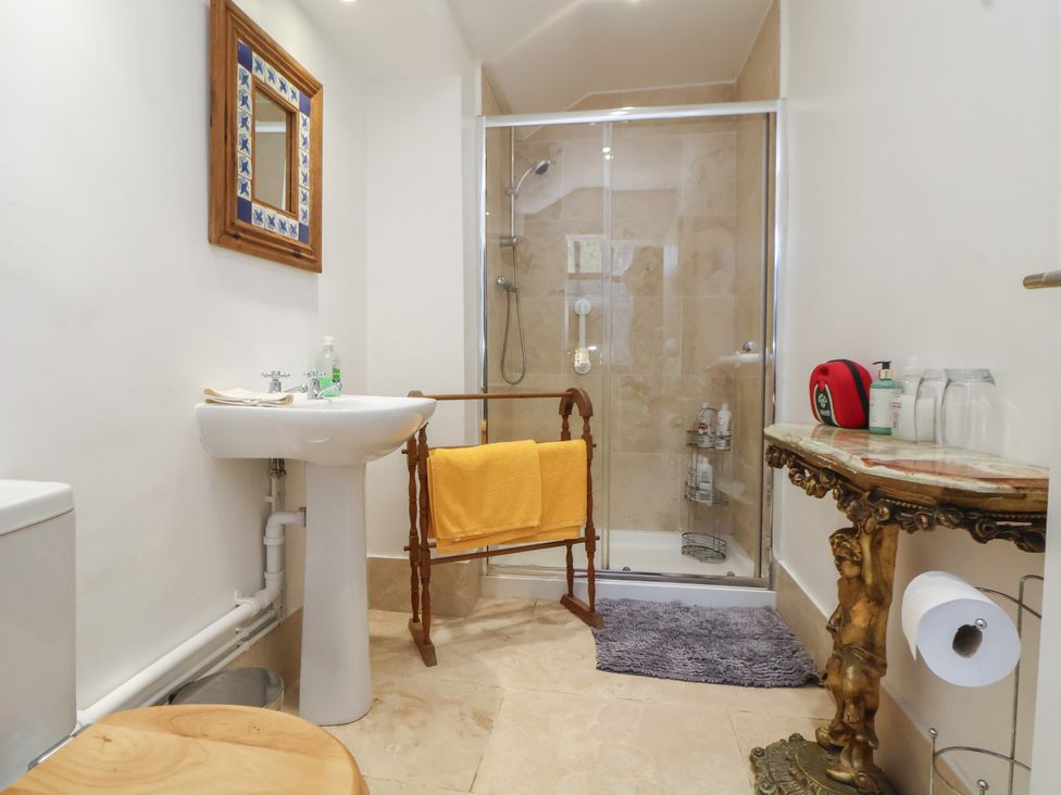 A bathroom with a shower and sink at The Jewel In The Crown near Biddulph Moor