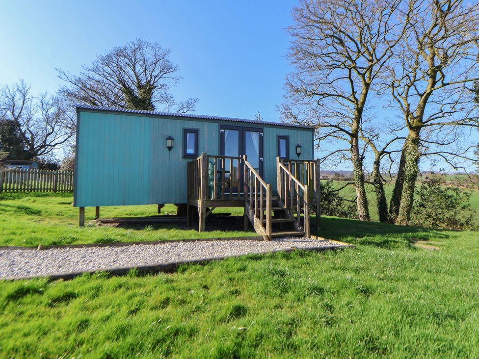 A cabin with steps in the garden at Shepherds Delight Biddulph Moor