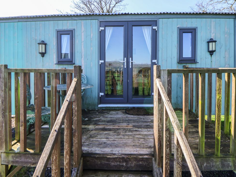 Entrance with steps and seating area at Shepherds Delight in Biddulph Moor