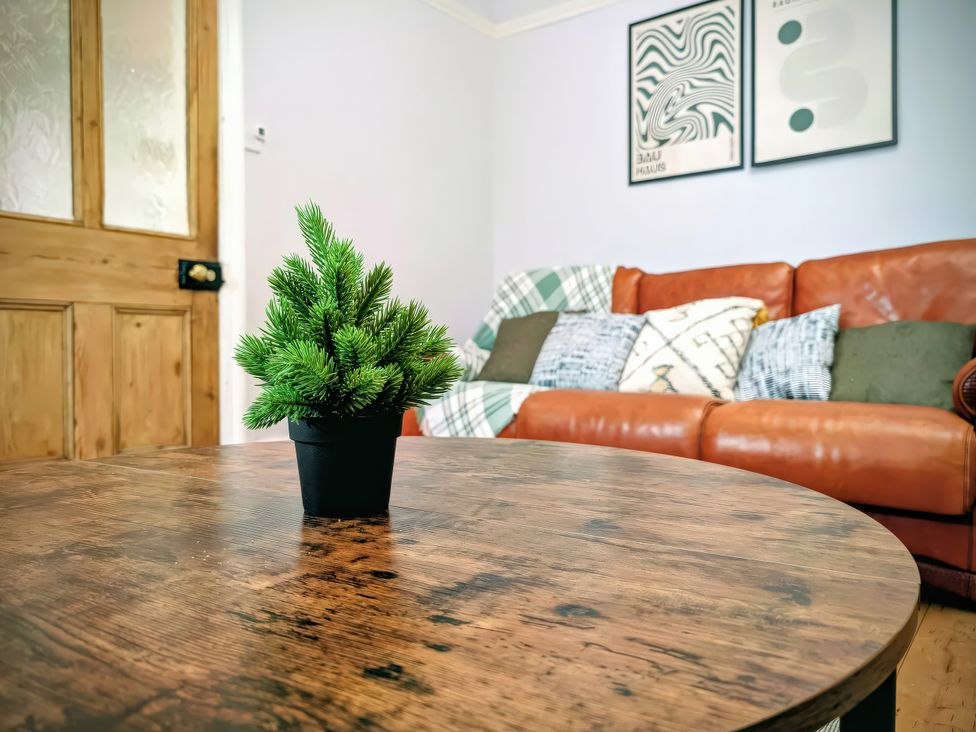 A living room with a coffee table and plant at 4 The Croft in Hexham