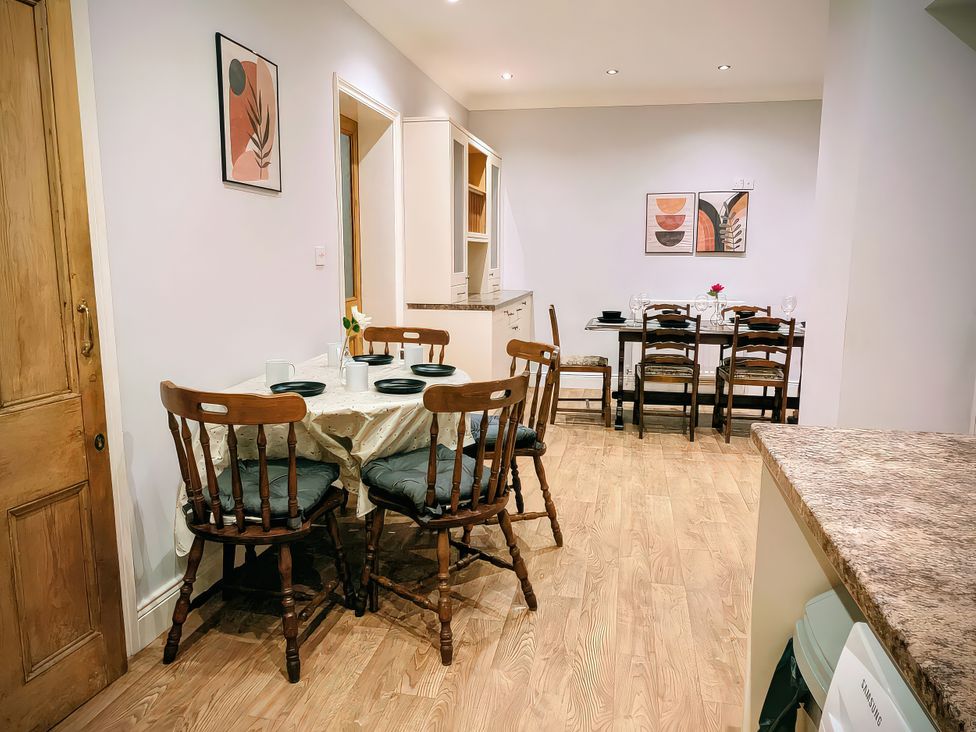 A dining room with a table and chairs at 4 The Croft in Hexham