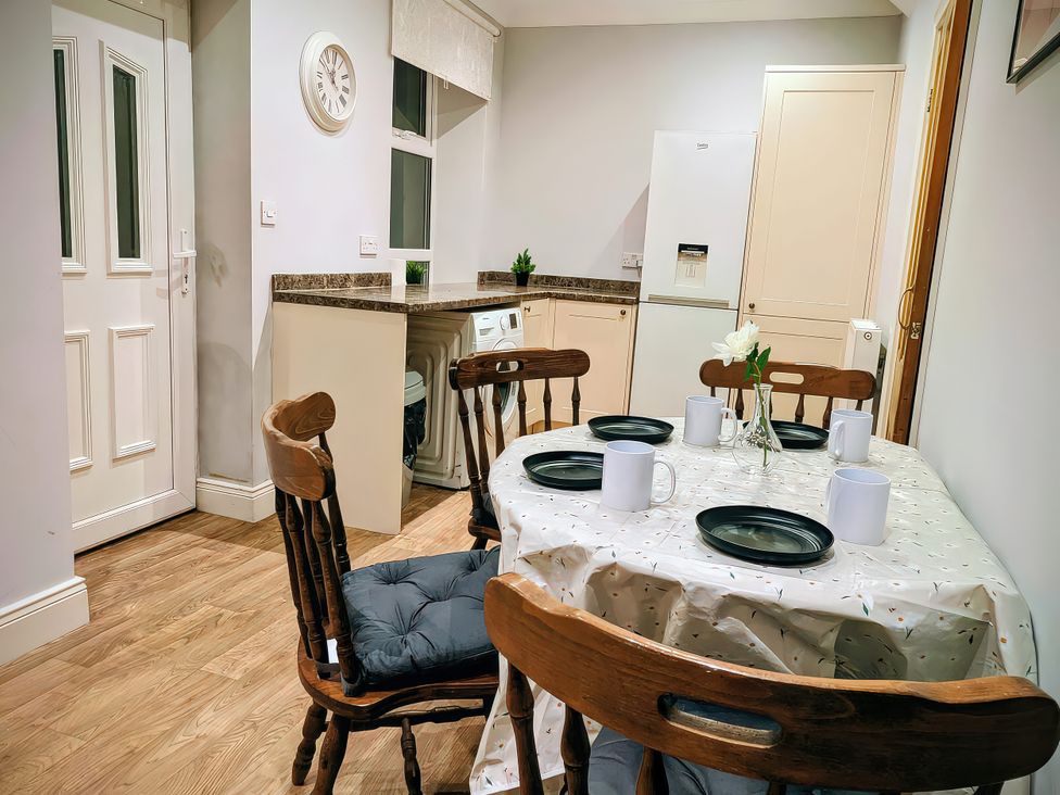A dining room with a table and chairs at 4 The Croft in Hexham
