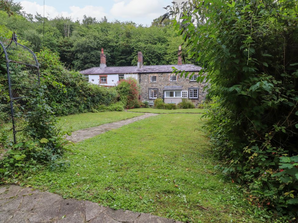 A house with a garden and pathway at 3 Tre Felin in Llandygai near Bangor