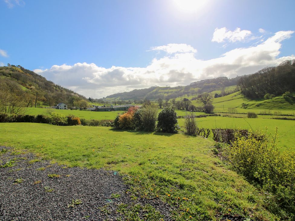 A landscape view with hills and grassland at Spring Bank in Llanfyllin
