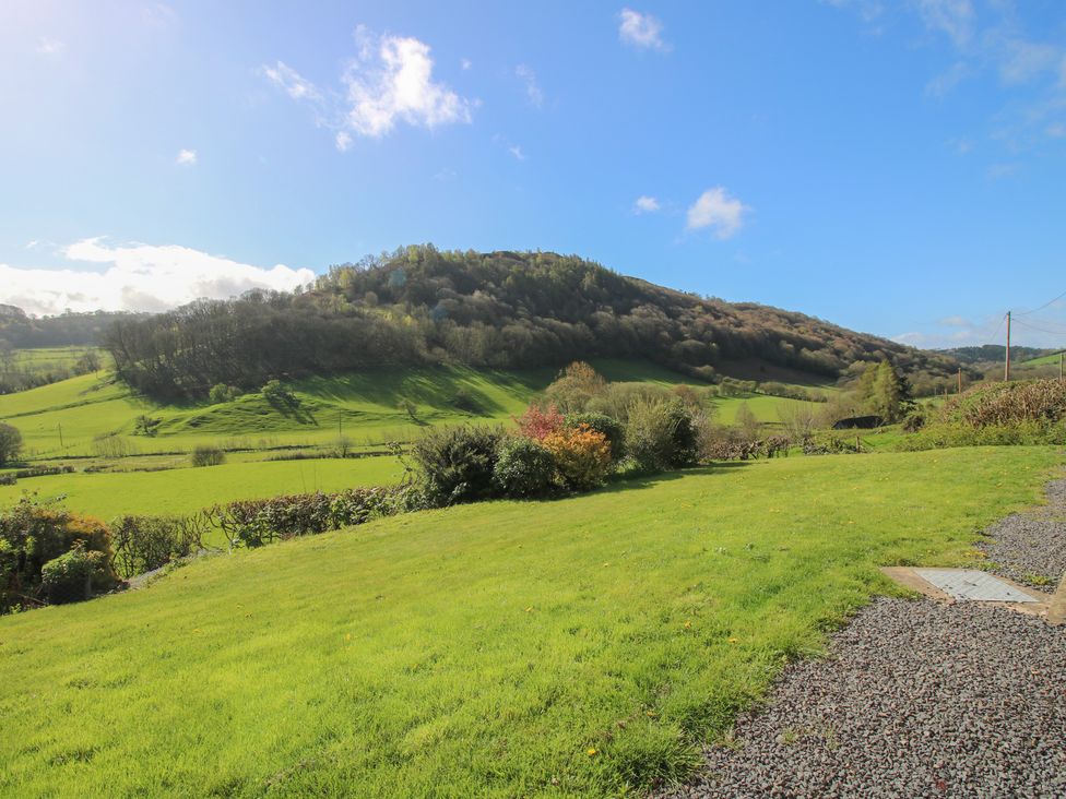 A landscape view featuring hills and greenery at Spring Bank in Llanfyllin