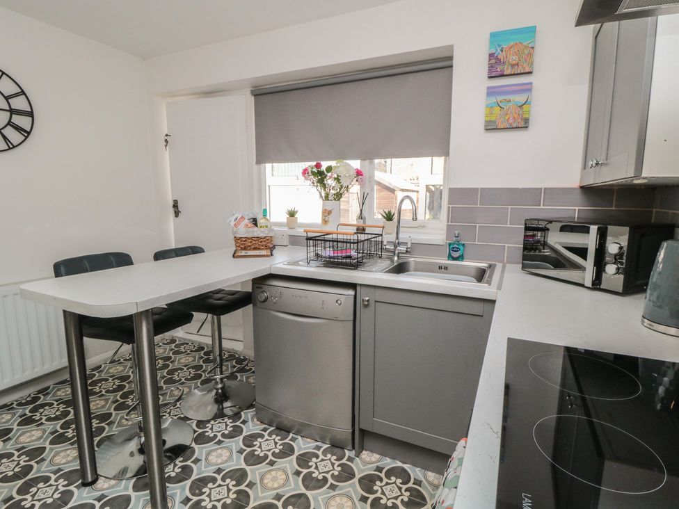 A kitchen with a sink and countertop at Coastal Retreat in Scarborough