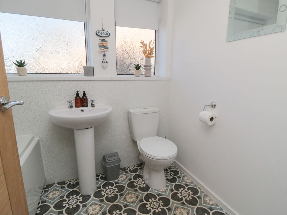 A bathroom with a sink and toilet at Coastal Retreat in Scarborough