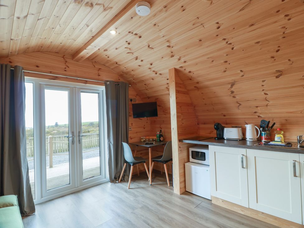 A kitchen area with table and chairs at Douglas in Stoneykirk near Sandhead