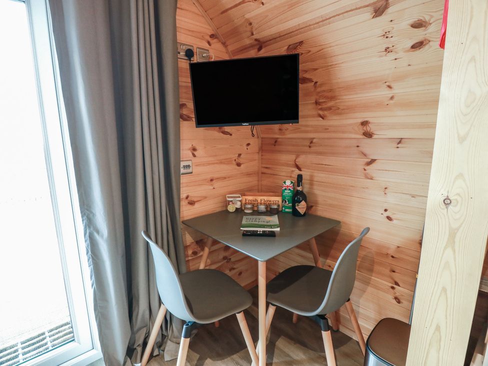 A dining area with a table and chairs at Douglas in Stoneykirk near Sandhead