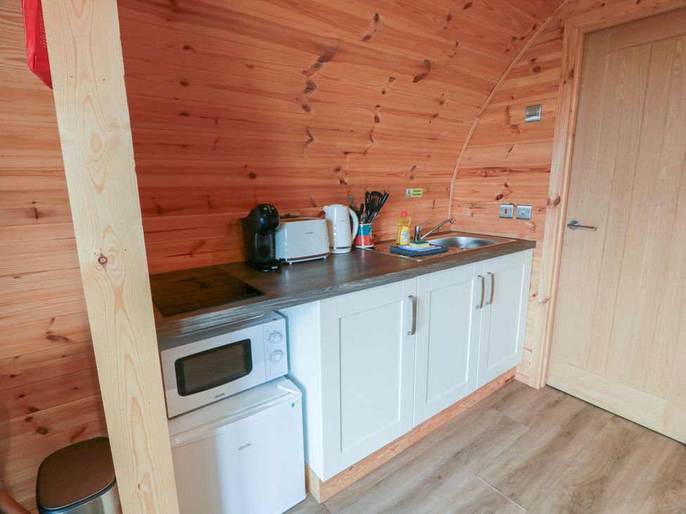 A kitchen with a sink and appliances at Douglas in Stoneykirk near Sandhead