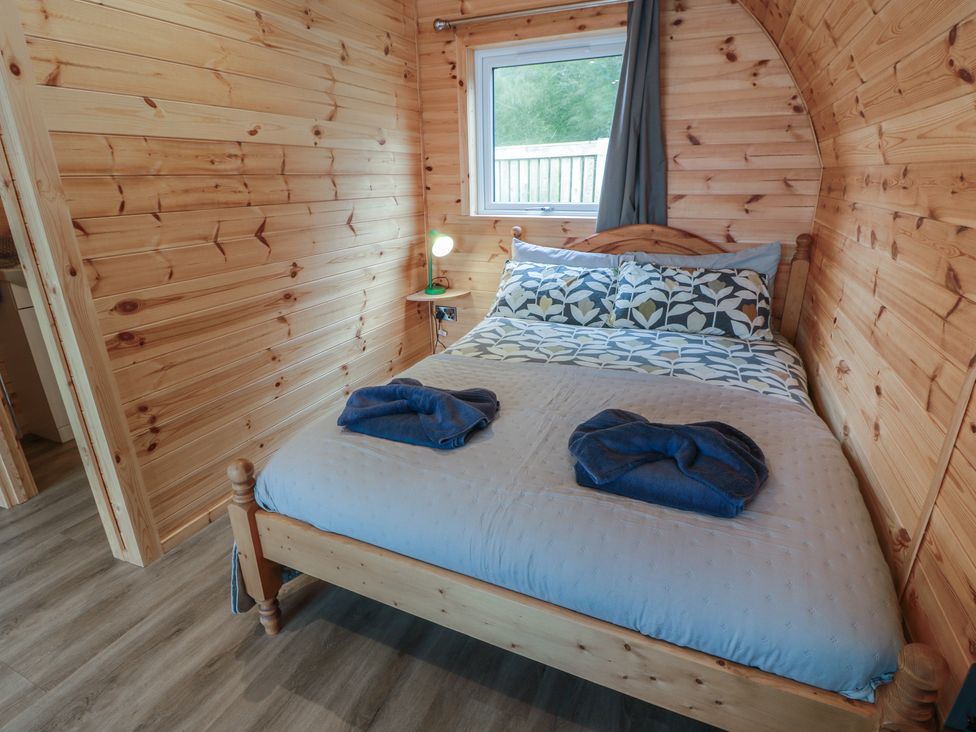 A bedroom with a bed and a window at Douglas Stoneykirk near Sandhead