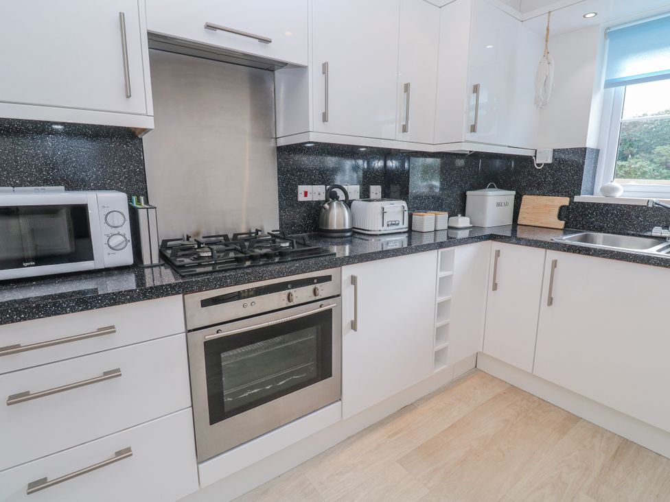 A kitchen with appliances and counter space at 21 Compass Point Carbis Bay
