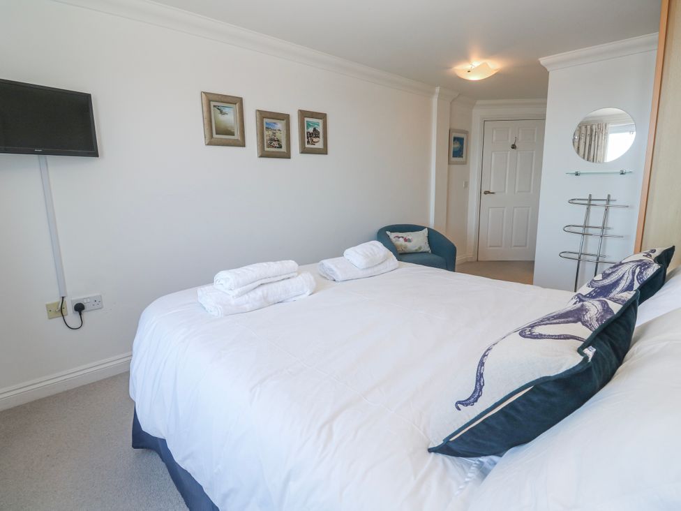 A bedroom with a bed and TV at 21 Compass Point Carbis Bay
