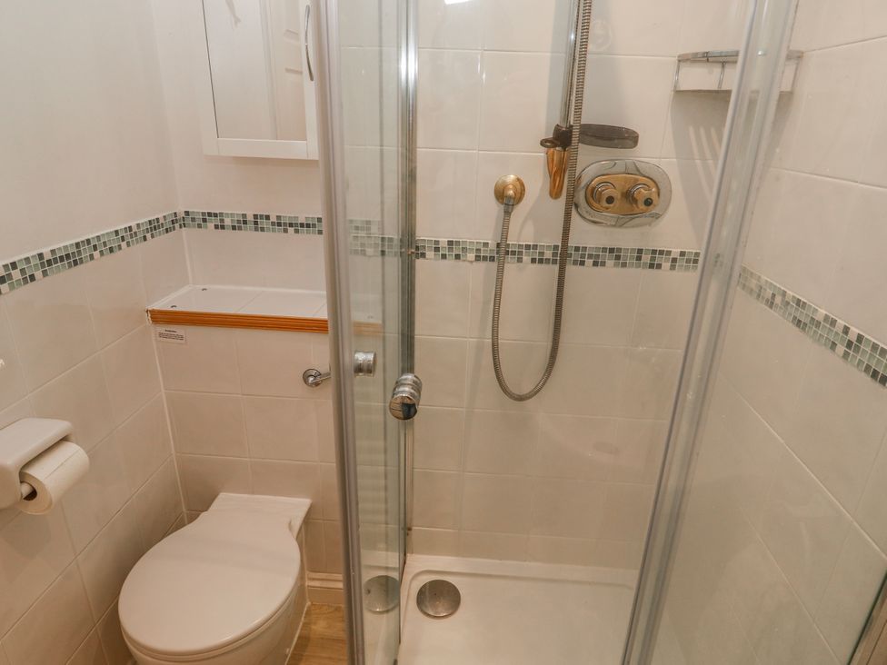 A bathroom with a shower and toilet at 21 Compass Point Carbis Bay