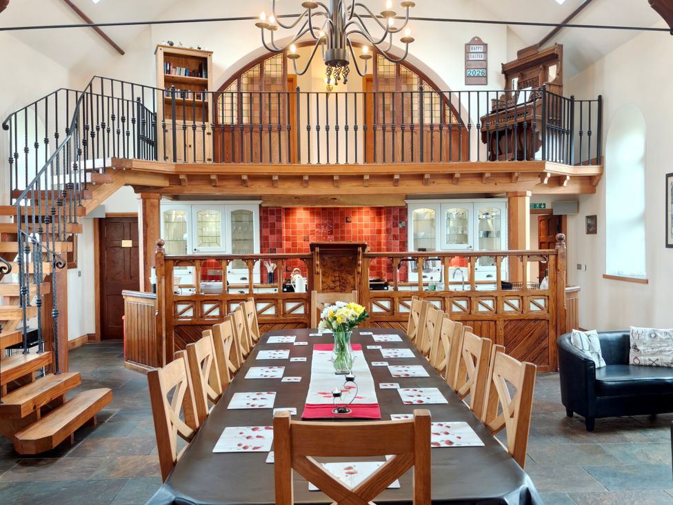 A dining room with a large table and chairs at Kaber Chapel near Kirby Stephen