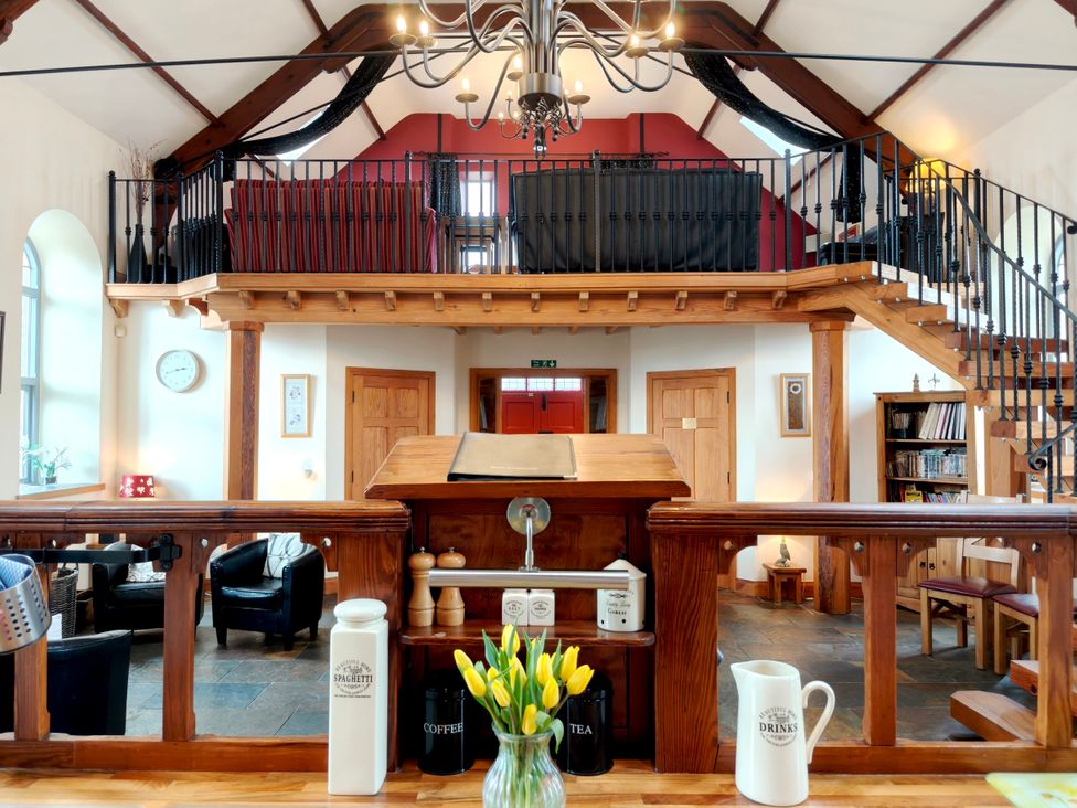 A common area with a staircase and balcony at Kaber Chapel near Kirby Stephen