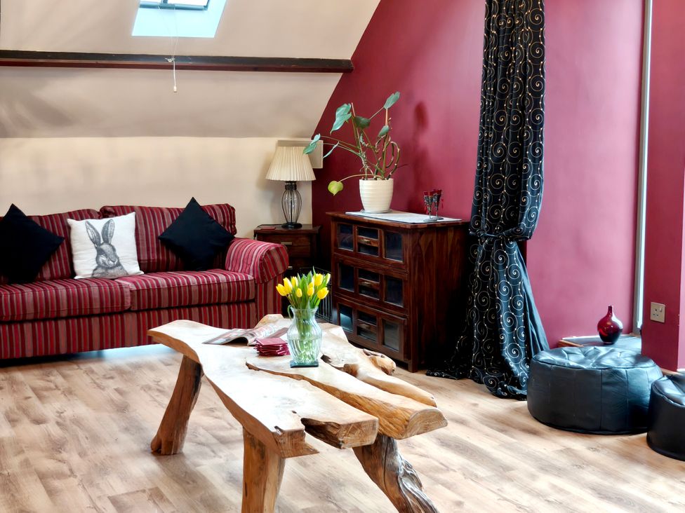 A living room with a sofa and a coffee table at Kaber Chapel in Kaber near Kirby Stephen