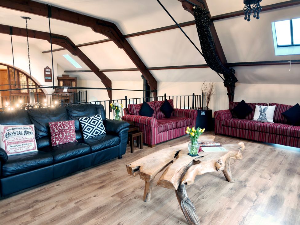A living room with seating and a wooden coffee table at Kaber Chapel in Kaber near Kirby Stephen