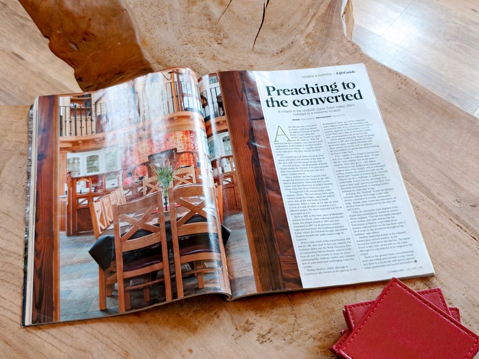 A magazine open to an article about a chapel at Kaber Chapel in Kaber near Kirby Stephen