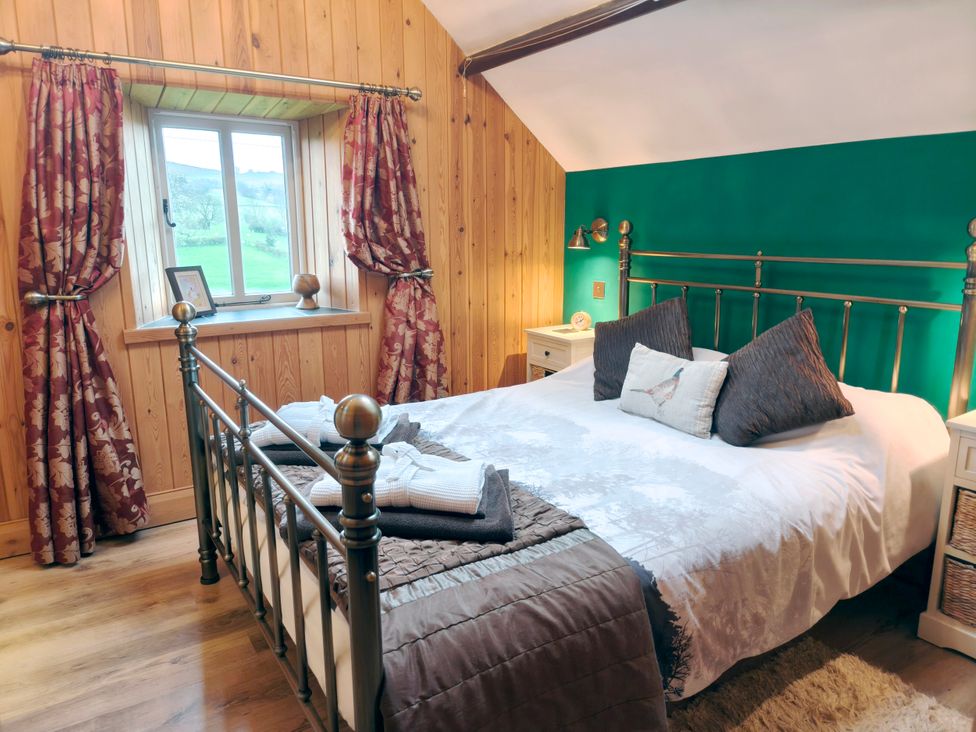 A bedroom with a bed and window at Kaber Chapel in Kaber near Kirby Stephen