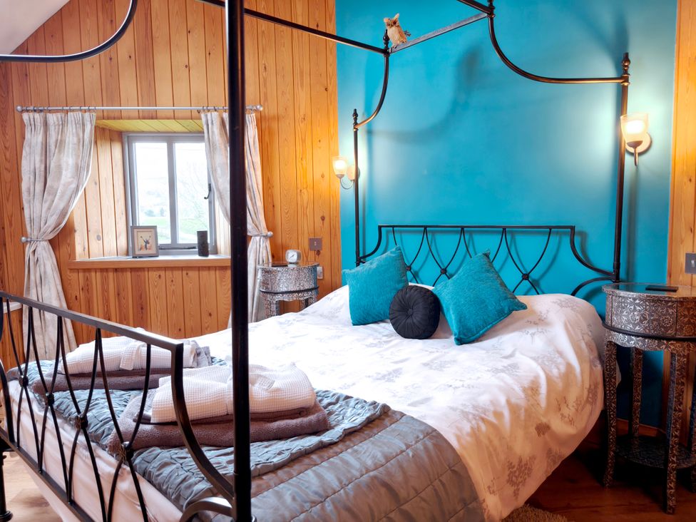 A bedroom with a bed and window at Kaber Chapel near Kirby Stephen