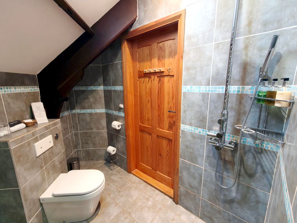 A bathroom with a shower and toilet at Kaber Chapel in Kaber near Kirby Stephen