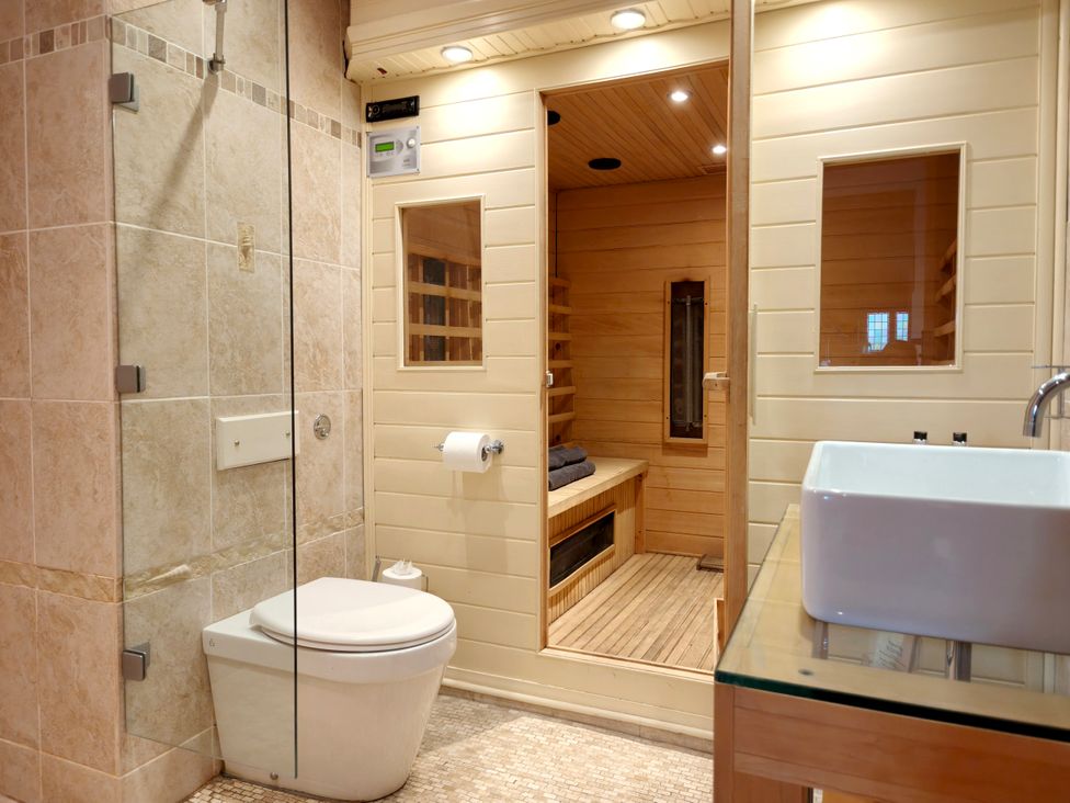 A bathroom featuring a shower, toilet, sink, and sauna at Kaber Chapel in Kaber near Kirby Stephen